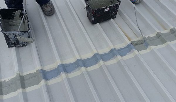 roof sheet overlaps cut edge coating inside masking taped area