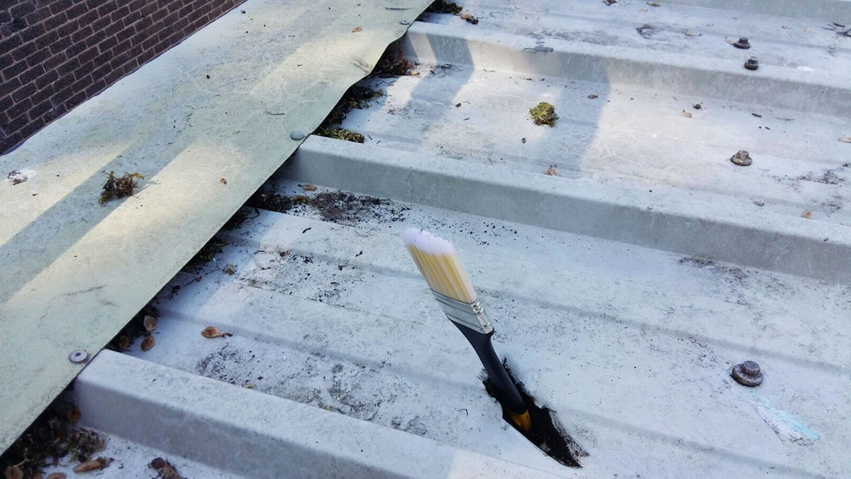 leaking steel roof sheet with hole
