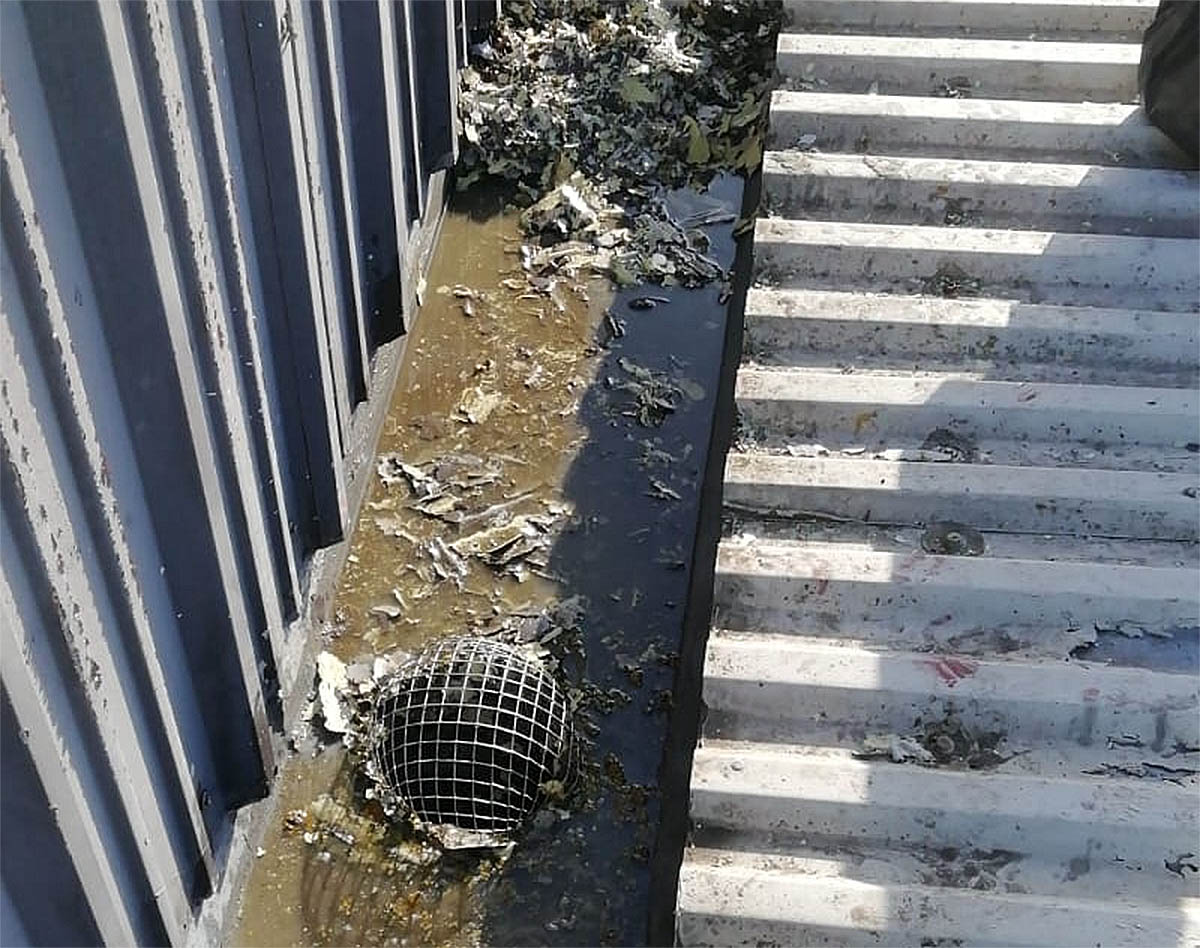 seriously blocked commercial roof guttering