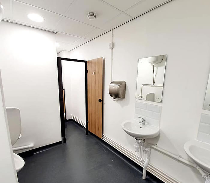 office toilets painted white walls