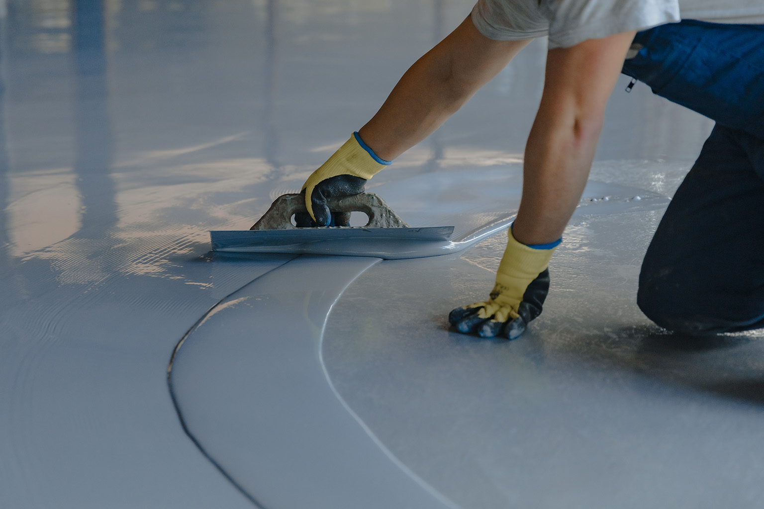 factory floor epoxy resin application process by hand