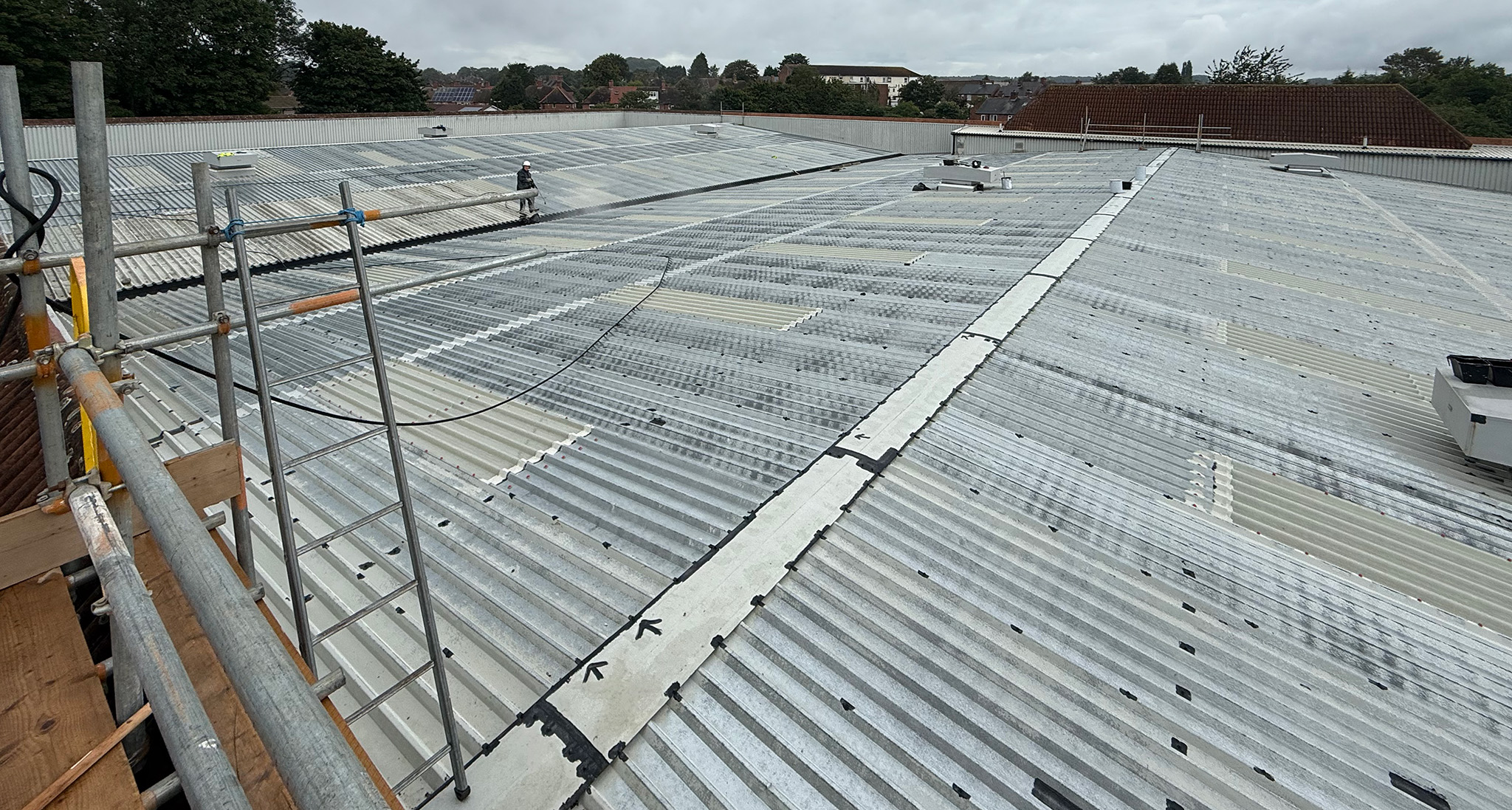 Cleaning surface preparation localised repairs roof sheets Guttering steel roof
