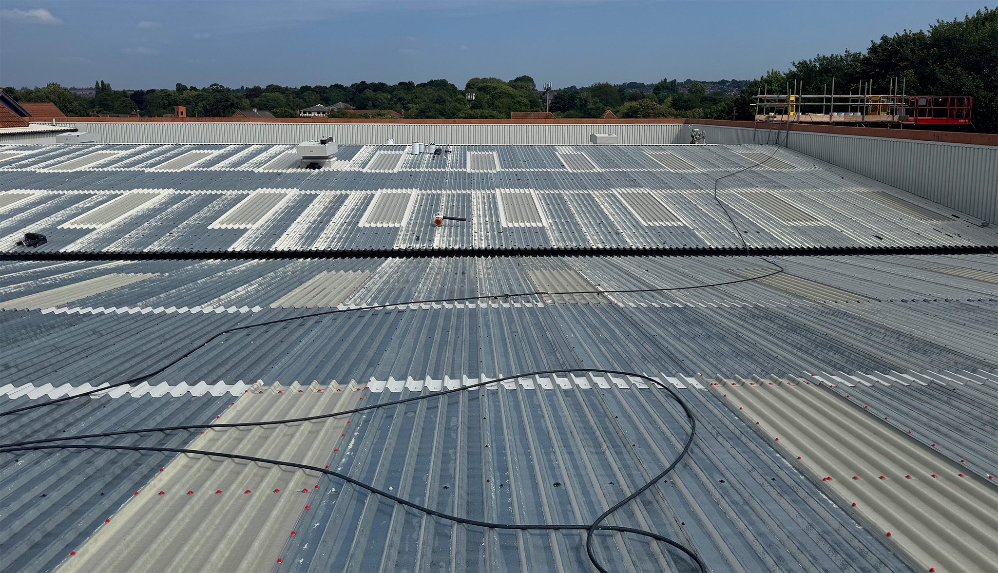 Cut edge corrosion treatment large retail unit roof
